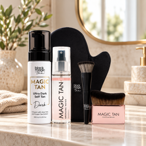 Magic Tan Ultra Dark Self Tan Kit with mousse, bronzing water, glove and brushes on a beauty counter