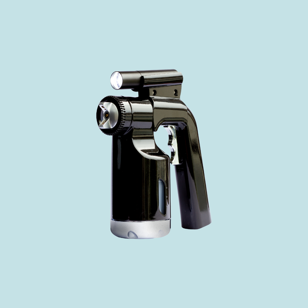 Angled view of the Tru Light Spray Gun with built-in illumination and stainless steel components